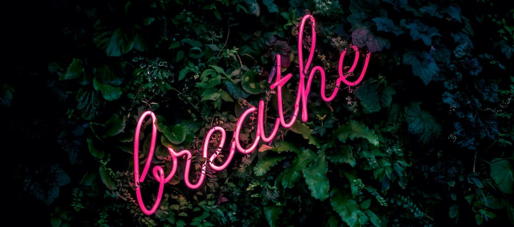 Neon "Breathe" sign